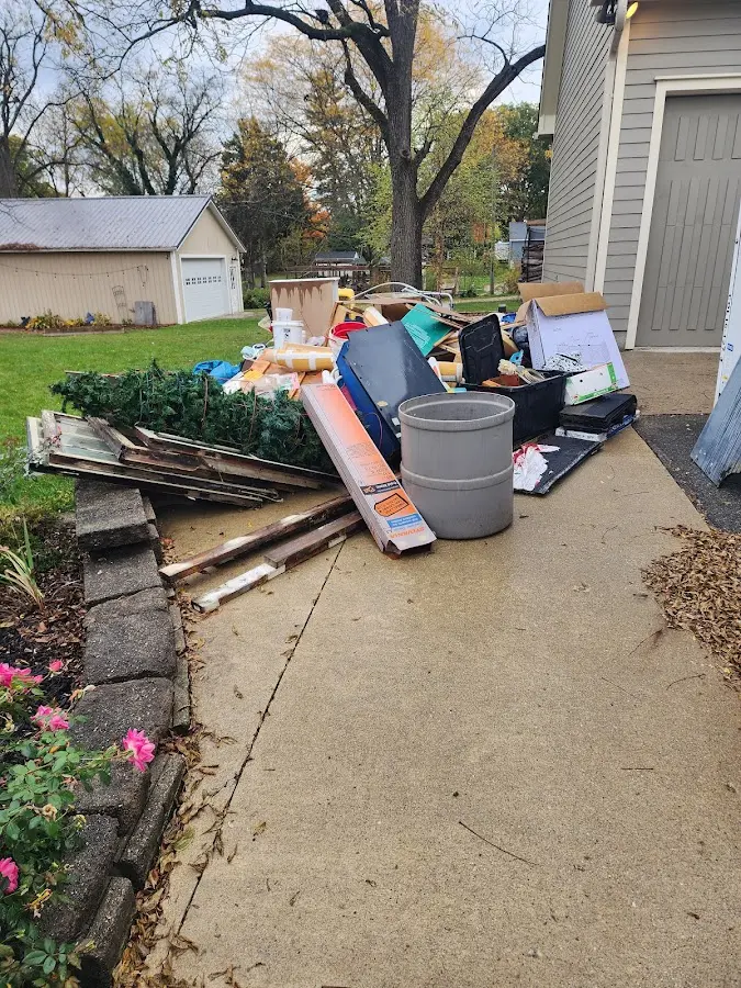 Dumpster being loaded with debris for Estate Cleanout Dumpster Rental in Dixon